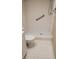 Clean bathroom with shower, toilet and grab bar at 12000 Capri S Cir # 16, Treasure Island, FL 33706