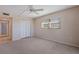 Spacious bedroom with ceiling fan and closet at 12000 Capri S Cir # 16, Treasure Island, FL 33706