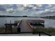 Wooden dock extending into a peaceful lake at 18843 Ulmus St, Lutz, FL 33558