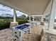 Covered patio with foosball table and ping pong at 18843 Ulmus St, Lutz, FL 33558