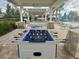 Outdoor game area with foosball and ping pong at 18843 Ulmus St, Lutz, FL 33558