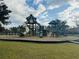 playground with slides, climbing structures, and a soft surface at 18843 Ulmus St, Lutz, FL 33558