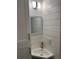 Small bathroom with corner sink and white shiplap walls at 2925 Clinton S St, Gulfport, FL 33707