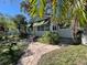 Quaint one-story home with landscaped yard and walkway at 2925 Clinton S St, Gulfport, FL 33707