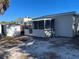 Rear view of a house and storage shed at 2925 Clinton S St, Gulfport, FL 33707