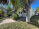 House exterior showcasing a walkway and mature landscaping at 2925 Clinton S St, Gulfport, FL 33707