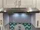 Stainless steel range hood with integrated lighting at 2925 Clinton S St, Gulfport, FL 33707