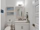 Bathroom with toilet, vanity, and framed art at 5316 Loon Nest Ct, Apollo Beach, FL 33572