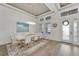 Elegant dining room featuring a large table, chandelier, and hardwood floors at 5316 Loon Nest Ct, Apollo Beach, FL 33572