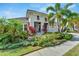 House with lush landscaping and a welcoming front porch at 5316 Loon Nest Ct, Apollo Beach, FL 33572