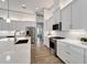 Bright kitchen featuring white cabinets and quartz countertops at 5316 Loon Nest Ct, Apollo Beach, FL 33572