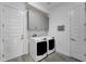 Laundry room with washer, dryer, and cabinets at 5316 Loon Nest Ct, Apollo Beach, FL 33572