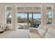 Living room with sliding doors opening to a patio and pool at 5316 Loon Nest Ct, Apollo Beach, FL 33572