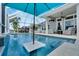 Inviting swimming pool with a built-in umbrella holder at 5316 Loon Nest Ct, Apollo Beach, FL 33572