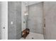 Large walk-in shower with gray tile and built-in bench at 5316 Loon Nest Ct, Apollo Beach, FL 33572