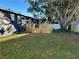 Charming backyard with grassy lawn and a newly-built wooden deck at 5703 S Sheridan Rd, Tampa, FL 33611