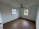 Bright bedroom with hardwood floors and ceiling fan at 5703 S Sheridan Rd, Tampa, FL 33611