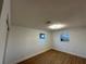 Spacious bedroom with wood-look floors and ample natural light at 5703 S Sheridan Rd, Tampa, FL 33611