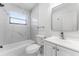 Modern bathroom with marble tile and updated vanity at 5100 3Rd S Ave, St Petersburg, FL 33707