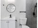 Contemporary bathroom with hexagon tile and floating vanity at 5100 3Rd S Ave, St Petersburg, FL 33707