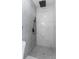 Elegant bathroom with marble and hexagon tile shower at 5100 3Rd S Ave, St Petersburg, FL 33707