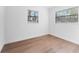 Spacious bedroom with two windows and laminate floors at 5100 3Rd S Ave, St Petersburg, FL 33707