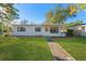 Charming ranch home with freshly landscaped lawn at 5100 3Rd S Ave, St Petersburg, FL 33707