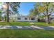 White single story home with a walkway and well-maintained lawn at 5100 3Rd S Ave, St Petersburg, FL 33707