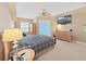 Bedroom featuring a ceiling fan, natural light and a comfortable bed at 11213 Warm Wind Way, Weeki Wachee, FL 34613