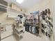 Bright walk-in closet featuring ample shelving and hanging space for organized storage at 11213 Warm Wind Way, Weeki Wachee, FL 34613