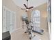 Bright workout room with natural light, ceiling fan, and exercise equipment for a home gym at 11213 Warm Wind Way, Weeki Wachee, FL 34613