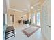 Welcoming foyer with decorative windows, chandelier, tile floors, and stylish accents at 11213 Warm Wind Way, Weeki Wachee, FL 34613