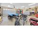 Spacious garage with plenty of room for parking, storage and recreational gear at 11213 Warm Wind Way, Weeki Wachee, FL 34613