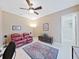 Cozy living area with plush seating, ceiling fan, and stylish decor for relaxed living at 11213 Warm Wind Way, Weeki Wachee, FL 34613