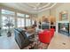 Inviting living room with fireplace, large windows, comfortable seating, and unique ceiling design at 11213 Warm Wind Way, Weeki Wachee, FL 34613