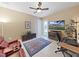 Bright home office space with comfortable seating, a ceiling fan, and access to the outdoors at 11213 Warm Wind Way, Weeki Wachee, FL 34613