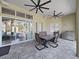 Covered patio features ceiling fans, a dining area and easy access to an outdoor grill at 11213 Warm Wind Way, Weeki Wachee, FL 34613