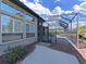 View of the screened-in pool and patio, featuring a peaceful view from the backyard at 11213 Warm Wind Way, Weeki Wachee, FL 34613