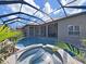 Inviting screened pool area featuring a spa and a covered pool for year-round enjoyment at 11213 Warm Wind Way, Weeki Wachee, FL 34613