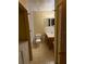 Small bathroom with toilet, sink, and bathtub at 1810 E Poinsettia Ave, Tampa, FL 33612