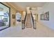 Grand staircase with wrought iron railings leading to upper level at 5407 Tybee Island Dr, Apollo Beach, FL 33572