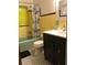 Retro bathroom with yellow tile and mint tub at 11523 Forest Hills Dr, Tampa, FL 33612