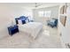 Stylishly decorated bedroom features modern furnishings, a ceiling fan, and tiled floors at 6075 Shore S Blvd # 306, Gulfport, FL 33707