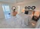 Bedroom with water views, stylish decor, and an ensuite bath at 6075 Shore S Blvd # 306, Gulfport, FL 33707