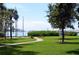 Scenic park view with green lawn, benches, and waterfront access at 6075 Shore S Blvd # 306, Gulfport, FL 33707