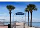 View of Williams Pier with palm trees and calm waterfront with boats, Gulfport, Florida at 6075 Shore S Blvd # 306, Gulfport, FL 33707