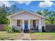 Charming bungalow with a stone walkway, porch, and fenced yard at 3508 N Dartmouth Ave, Tampa, FL 33603