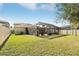 Screened patio and expansive backyard with lush grass and a private feel at 11544 Lake Lucaya Dr, Riverview, FL 33579