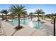 Resort-style community pool with spacious deck and palm trees at 11544 Lake Lucaya Dr, Riverview, FL 33579