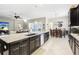 Island kitchen features granite countertops and stainless steel appliances at 11544 Lake Lucaya Dr, Riverview, FL 33579